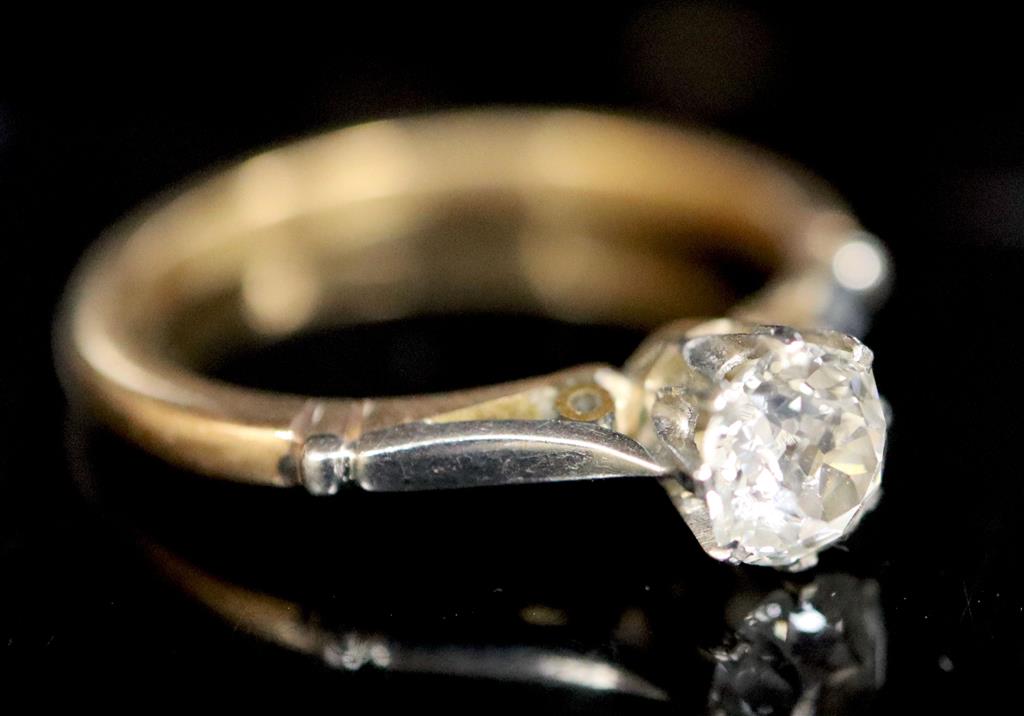 An 18ct gold and platinum, solitaire diamond ring,